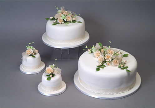 Custom wedding cake with sugar roses.